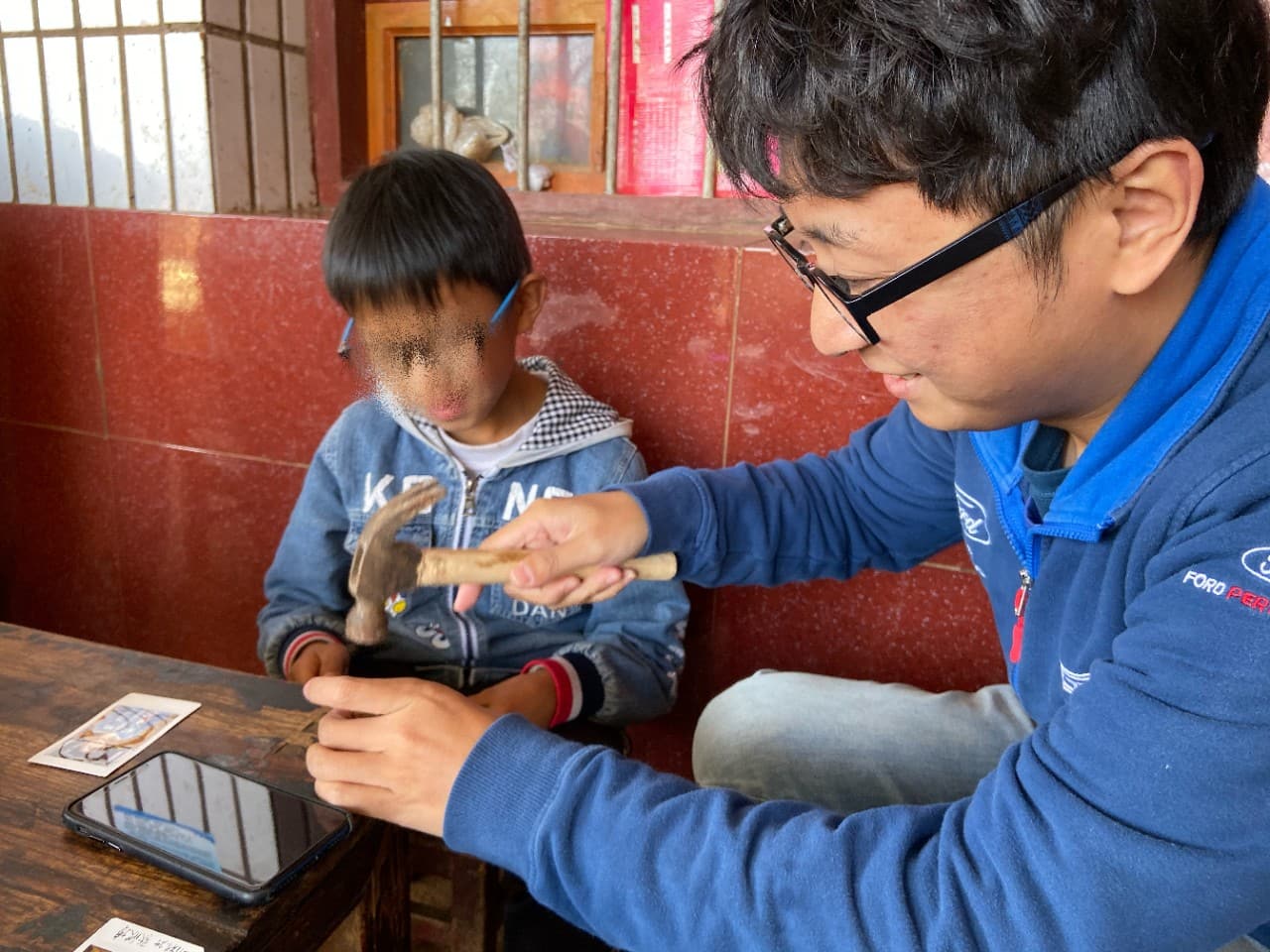 Ford volunteers visited orphans they sponsored every year.
