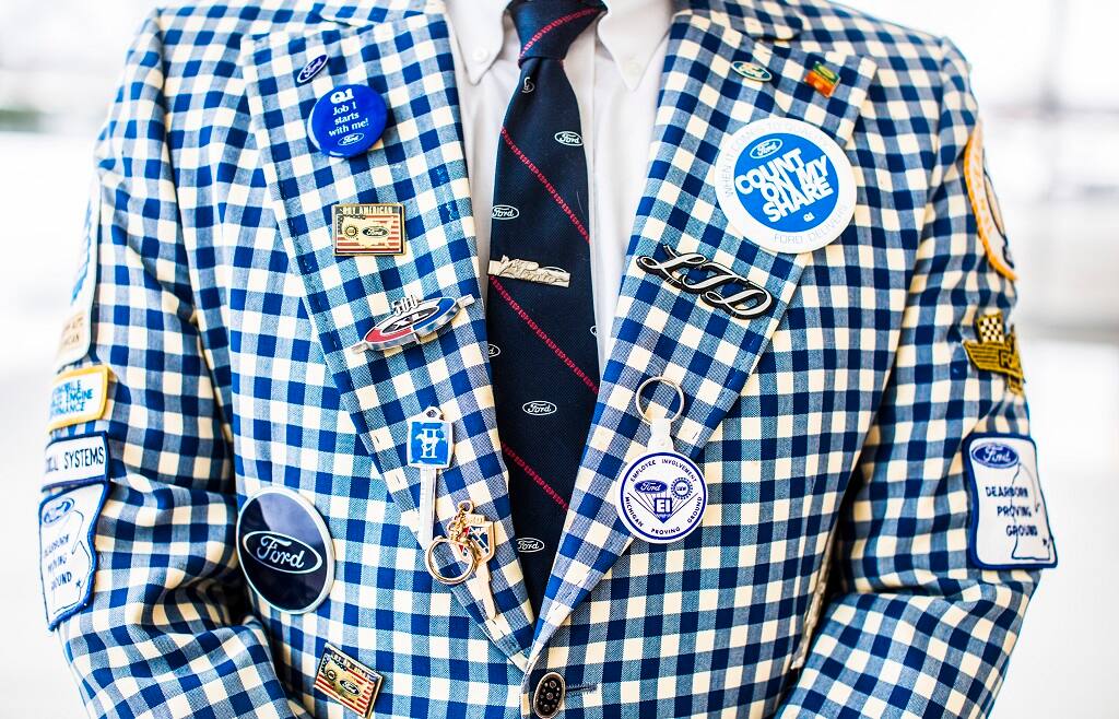 A closer look at the buttons and patches on the suit. A closer look at the buttons and patches on the suit.