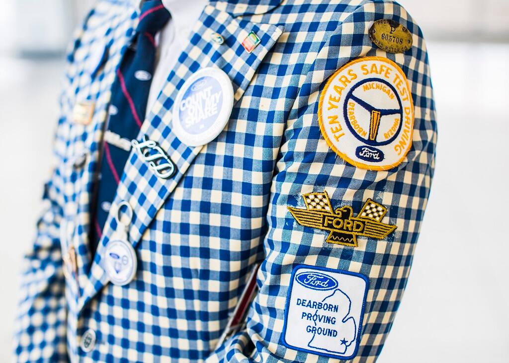 A closer look at the buttons and patches on the suit. A closer look at the buttons and patches on the suit.