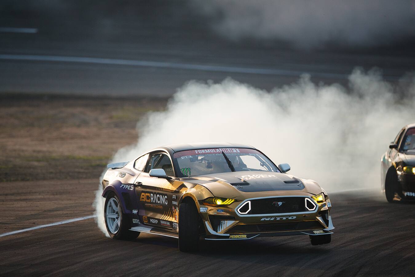 Chelsea DeNofa won in his Ford Mustang RTR Spec 5-D and Justin Pawlak placed third in his Mustang. Chelsea DeNofa won in his Ford Mustang RTR Spec 5-D and Justin Pawlak placed third in his Mustang.