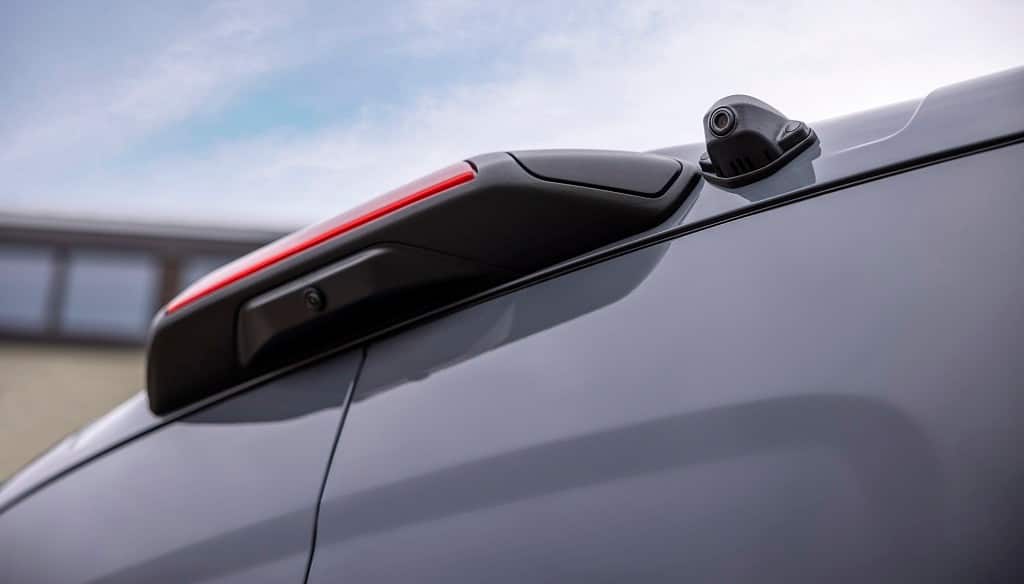 A camera located next to the center high-mounted brake light at the rear of the vehicle for the digital rearview mirror.