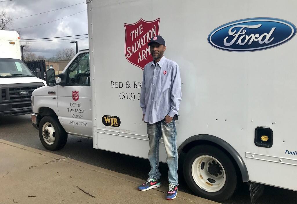 Maurice A. Farr stands by the Salvation Army truck.