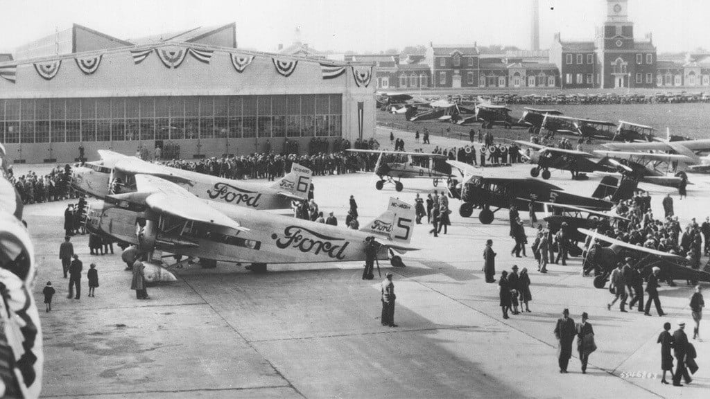 A black and white photo of airplanes at the Ford Airport.