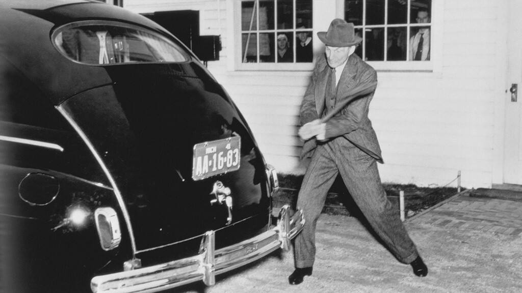 Henry Ford and his black car, some of the parts made from soybeans.