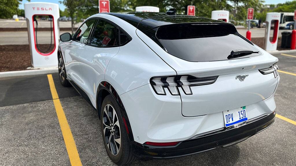 mustang mach e at tesla supercharger