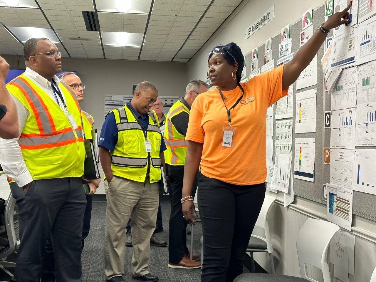 Lima Engine Plant’s PV6 Area Manager EK Umoh provides an overview of the plant’s Business Control Center during the second leg of the FPS Bus Tour. 
