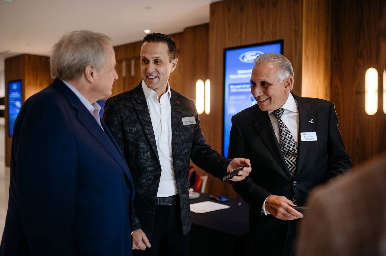 Edsel B. Ford II chats with dealers Bob Tasca III (center) and Paul Sabatini