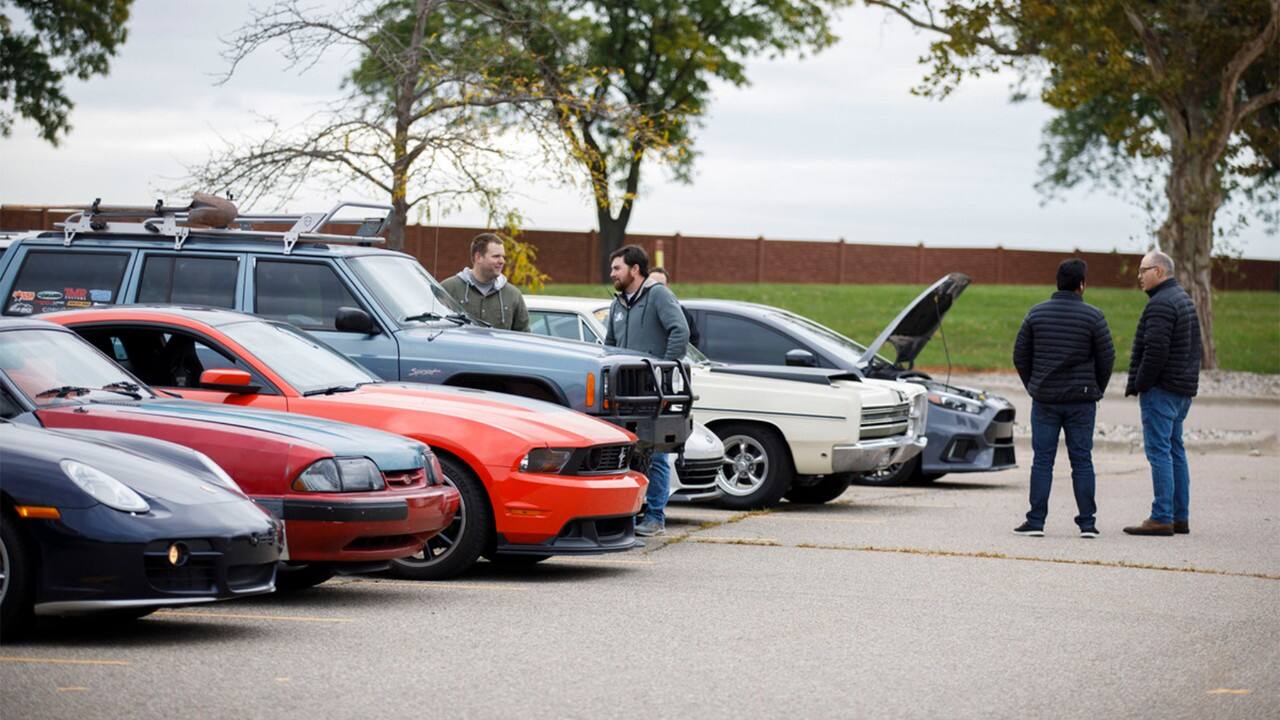 More than a dozen employees brought their favorite cars to show off on a chilly morning outside of Building 2.