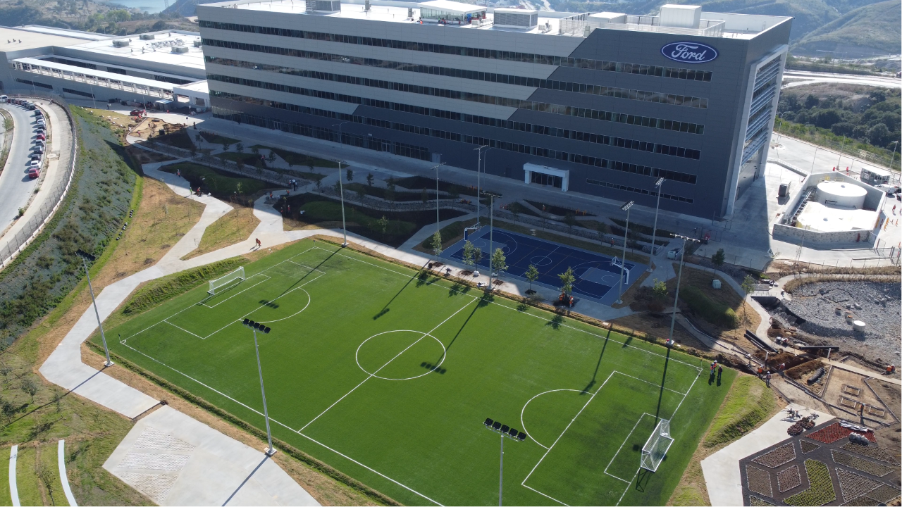 Sports fields by a Ford building