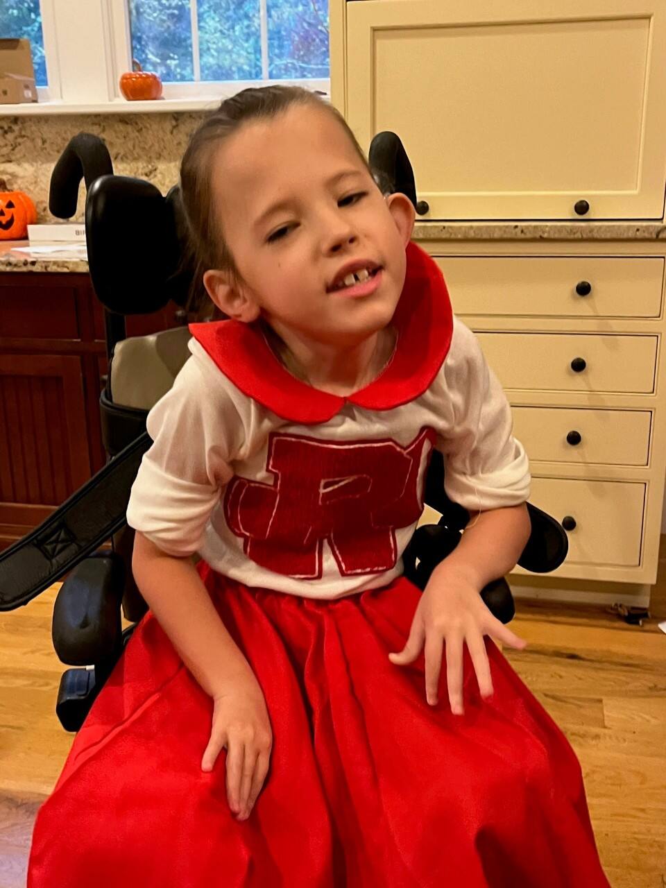 Leighton was born with congenital myotonic dystrophy, a type of muscular dystrophy characterized by progressive muscle weakness.  Halloween presents a unique challenge for her, as she is unable to walk and has limited use of her arms.  