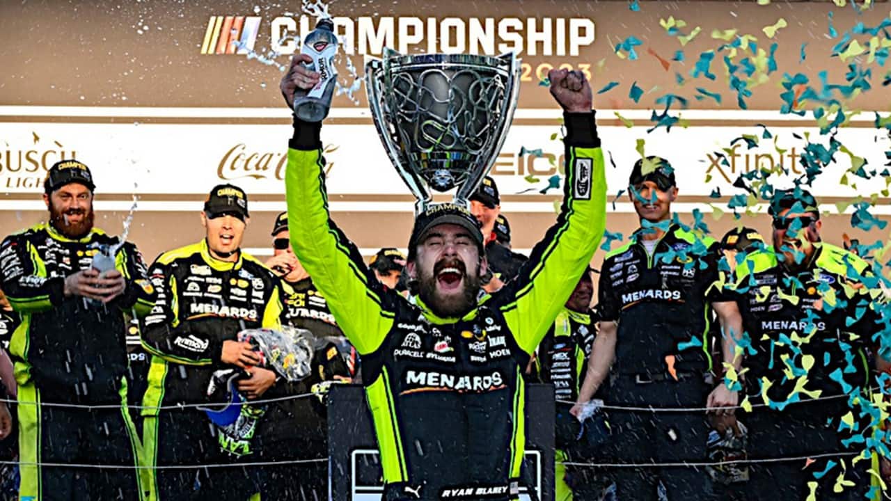 Ryan Blaney holds up the NASCAR Championship trophy