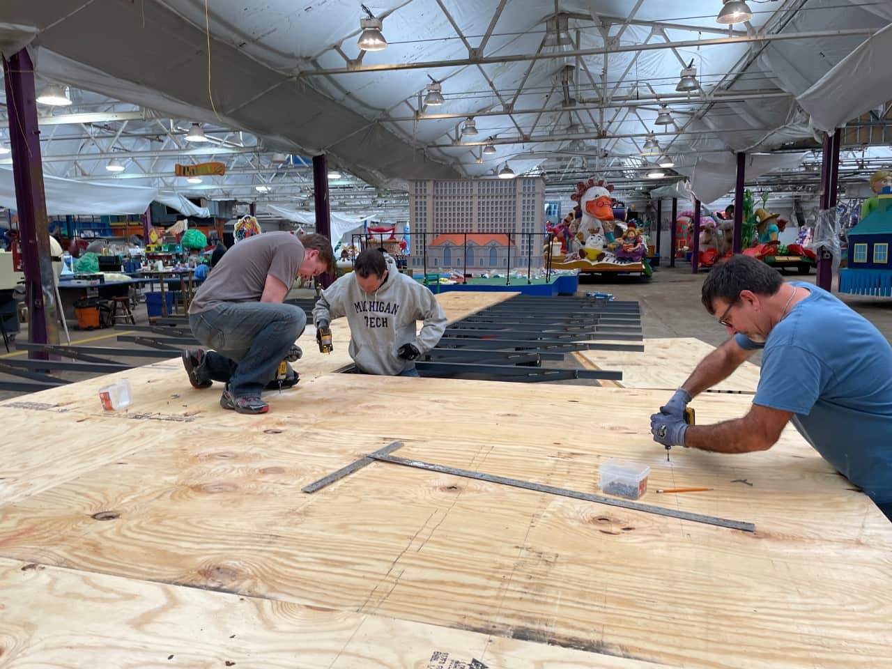 Volunteers work on a float