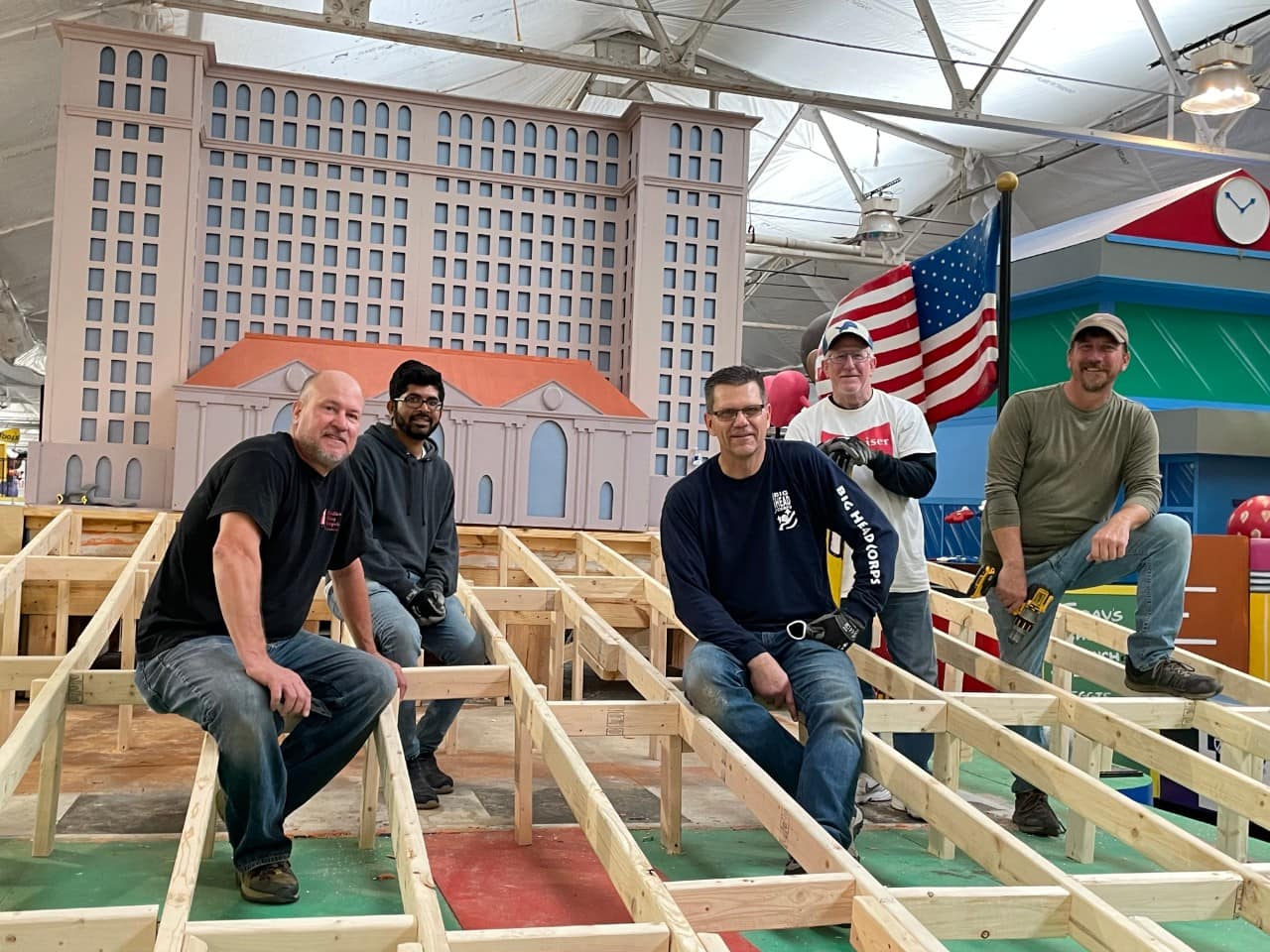 Volunteers on the float that they're building