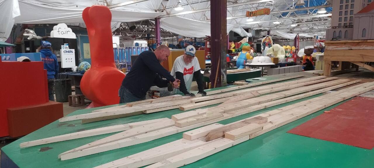 Volunteers put a float together