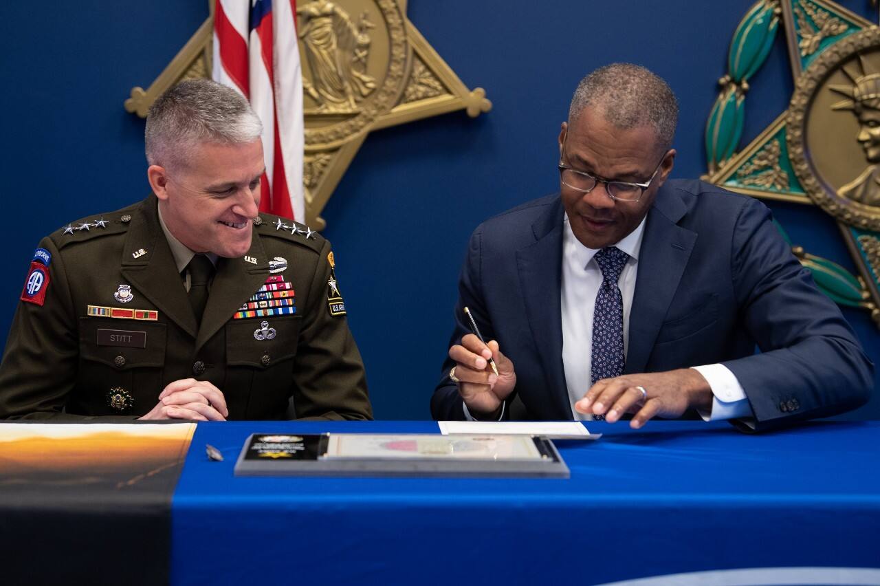Aug. 23, 2023, Lieutenant General Douglas Stitt and Ford Chief Government Affairs Officer Chris Smith sign the PaYS ceremonial agreement. 