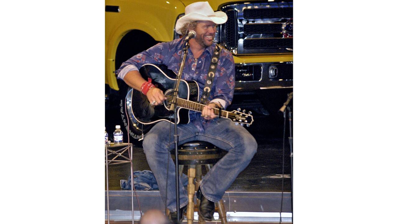 Keith is seen here performing for employees in the auditorium of Ford’s World Headquarters.