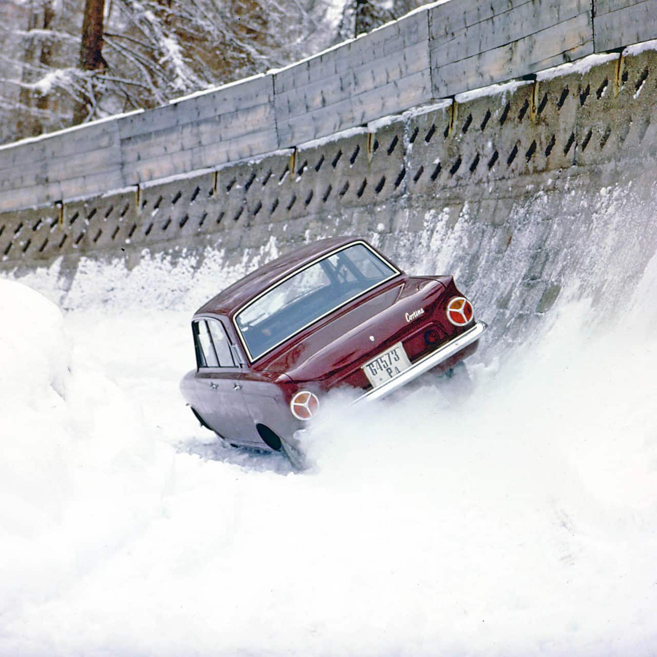 Ford Cortinas tackling an Olympic bobsleigh run back in 1964.