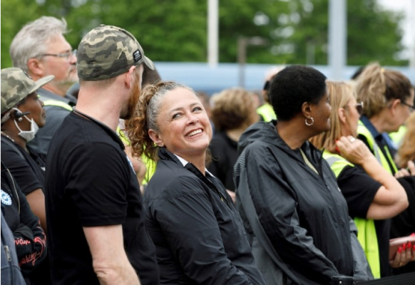 Employees smile in group